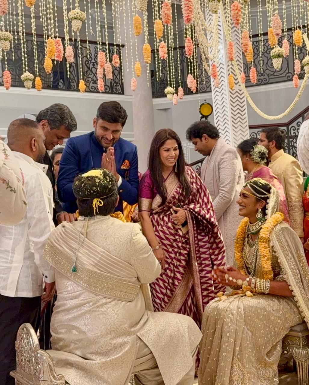 "PV Sindhu and Venkat Sai Dutta during their wedding ceremony at Udaipur's Raffles Hotel, dressed in matching cream outfits."